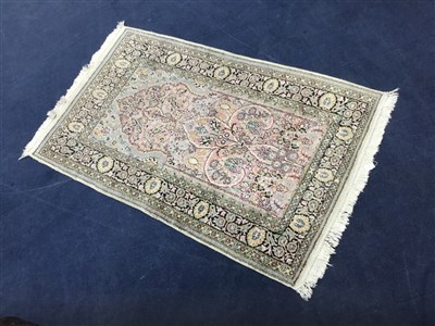 Lot 103 - A FRINGED BORDERED RUG OF PERSIAN DESIGN
