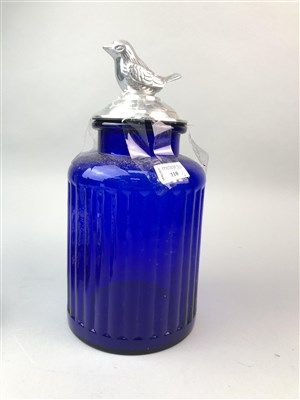 Lot 110 - A BLUE GLASS JAR, AN ONYX MODEL OF A WILDCAT, AN ASHET AND A TUREEN STAND