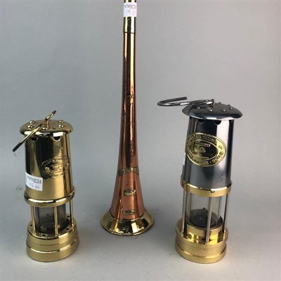 Lot 115 - A BRASS COACHING HORN AND TWO MINERS' SAFETY LAMPS
