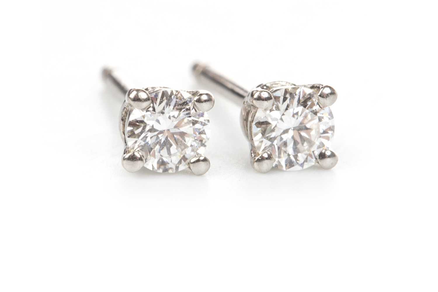 Lot 94 - A PAIR OF TIFFANY AND CO. DIAMOND STUD EARRINGS