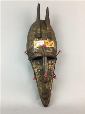 Lot 244 - AN AFRICAN MASK, SWORD, DAGGER AND FLY WHISKS