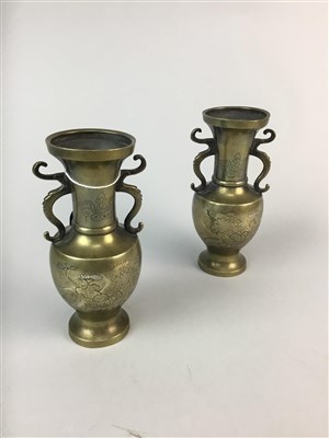 Lot 388 - A PAIR OF CHINESE TWIN HANDLED BRASS VASES