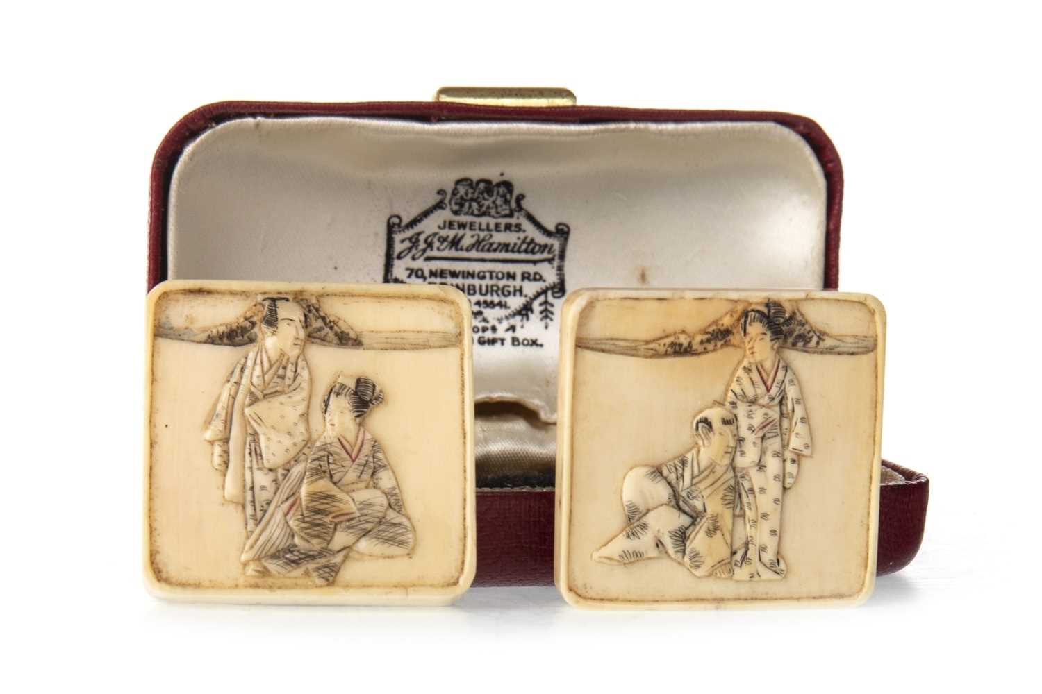 Lot 1123 - A PAIR OF JAPANESE IVORY BELT ACCOUTREMENTS