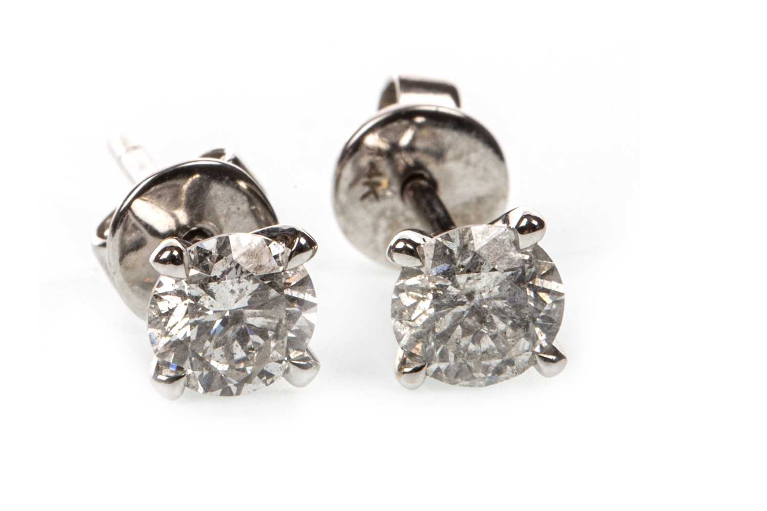Lot 10 - A PAIR OF CERTIFICATED DIAMOND SINGLE STONE EARRINGS