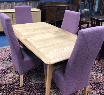 Lot 200 - A WILLIS & GAMBIER OAK DINING TABLE AND FOUR UPHOLSTERED DINING CHAIRS