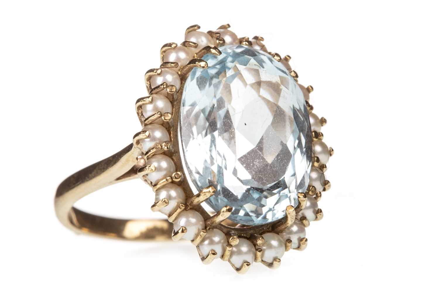 Lot 47 - A BLUE GEM AND PEARL RING