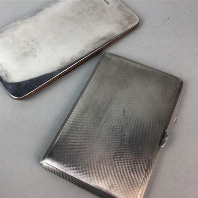 Lot 23 - AN ENGINE TURNED SILVER CIGARETTE CASE AND A MEMO CASE WITH SILVER MOUNTED COVERS