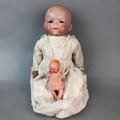 Lot 234 - A GERMAN BISQUE HEADED DOLL AND A MINIATURE DOLL