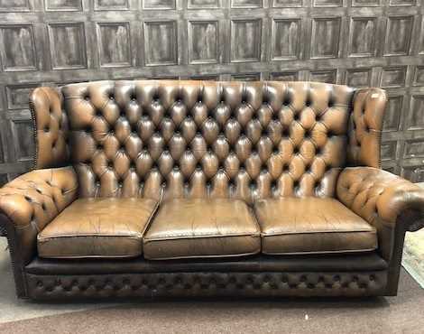 Lot 1662 - AN EARLY 20TH CENTURY BROWN LEATHER WING BACKED SETTEE AND ARMCHAIR