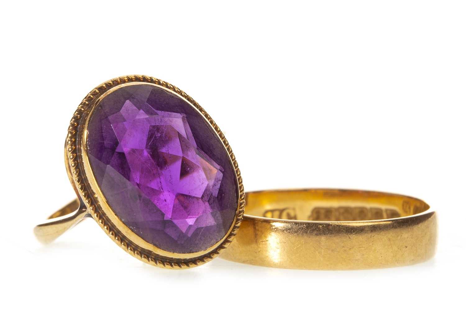 Lot 30 - AN AMETHYST RING AND A WEDDING BAND