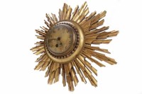 Lot 17 - ART DECO SUNBURST GILT WALL CLOCK the unsigned...