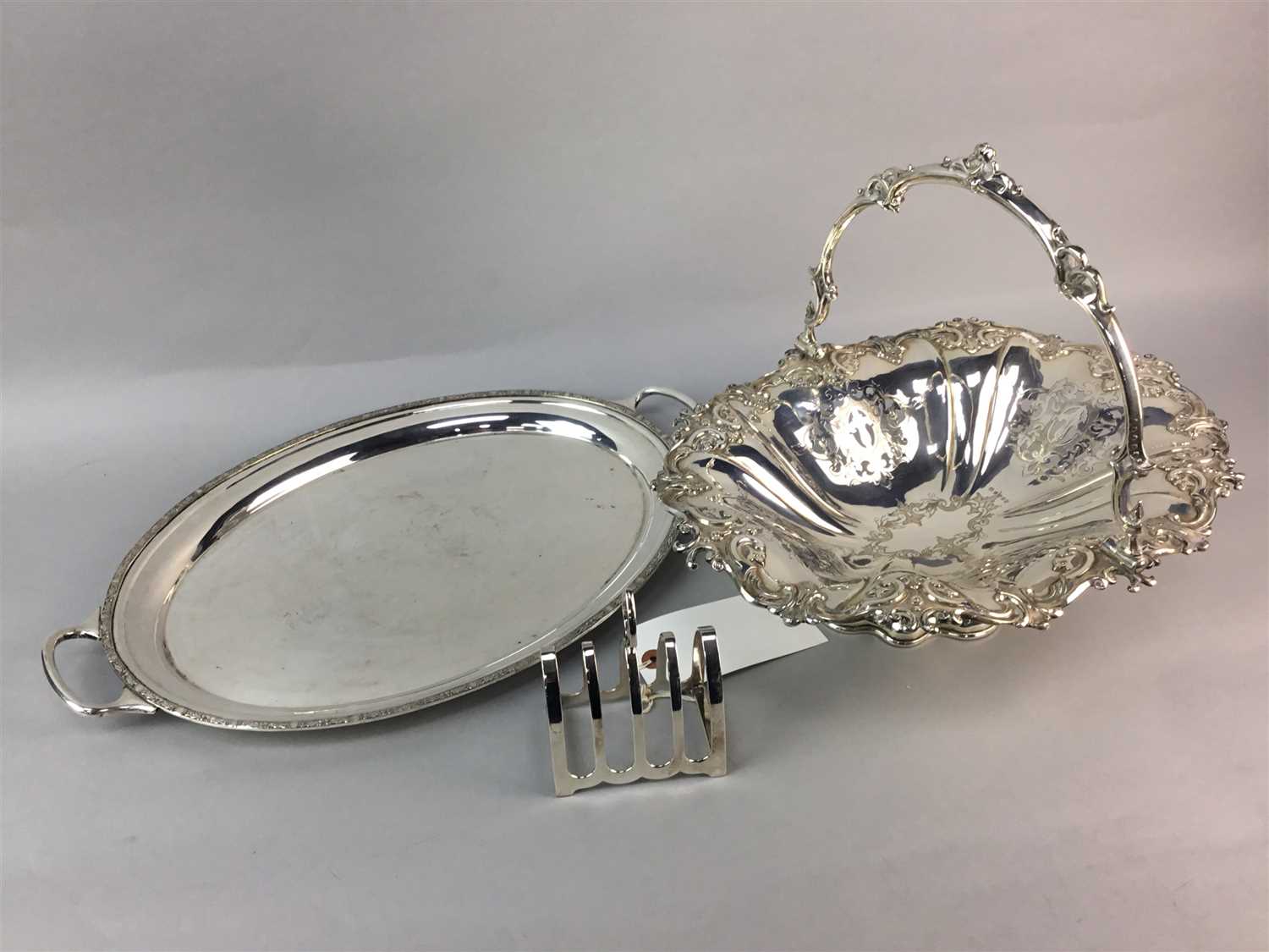 Lot 17 - A SILVER PLATED TRAY, BASKET, TOAST RACK AND OTHER PLATED WARES