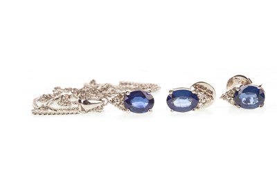 Lot 22 - A BLUE GEM AND DIAMOND PENDANT WITH MATCHING EARRINGS
