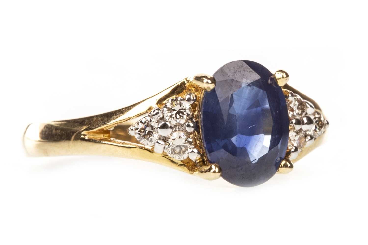 Lot 12 - A BLUE GEM AND DIAMOND RING