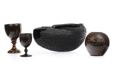 Lot 1135 - AN ISLAMIC EBONISED WOOD BEGGING BOWL AND OTHER ITEMS