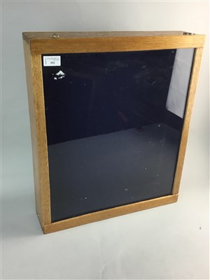 Lot 392 - A WALL HANGING DISPLAY CABINET