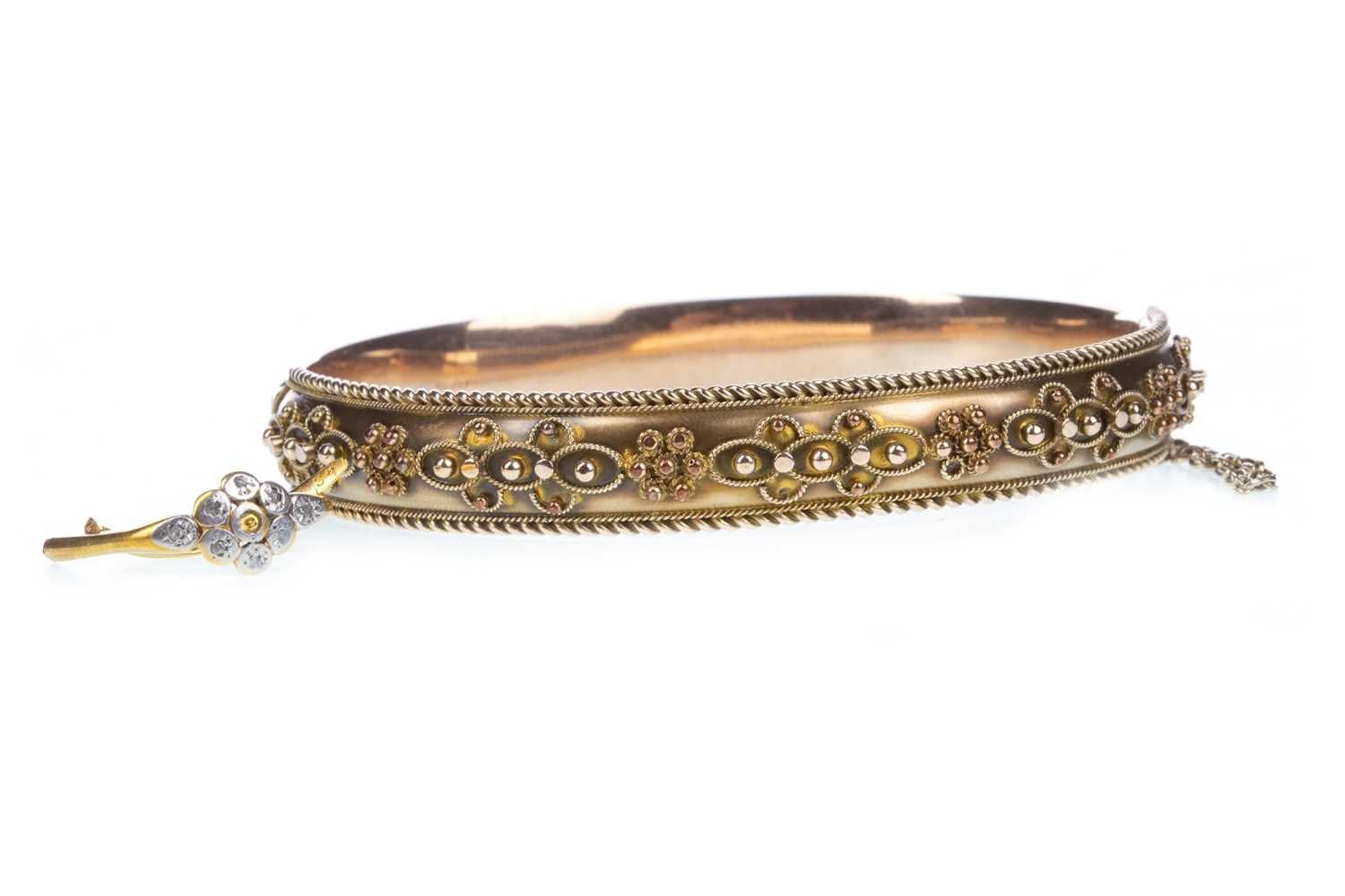 Lot 71 - A GOLD BANGLE AND A PARTIAL DIAMOND SET RING
