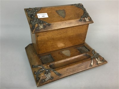 Lot 399 - AN OAK DESK STAND OF ARTS AND CRAFTS DESIGN