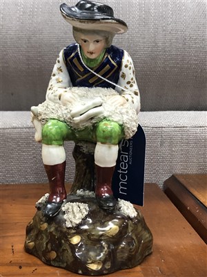 Lot 537 - AN EARLY 19TH CENTURY ROCKINGHAM FIGURE