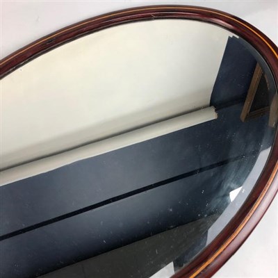 Lot 34 - TWO STAINED WOOD OVAL MIRRORS