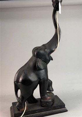 Lot 141 - A CARVED WOODEN ELEPHANT TABLE LAMP AND TWO OTHER LAMPS
