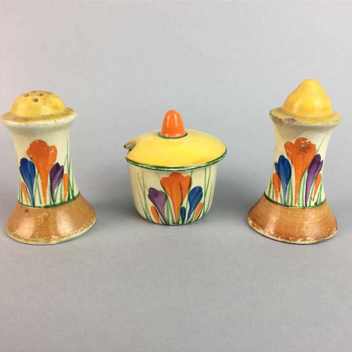 Lot 17 - A CLARICE CLIFF SALT AND PEPPER AND A MUSTARD POT