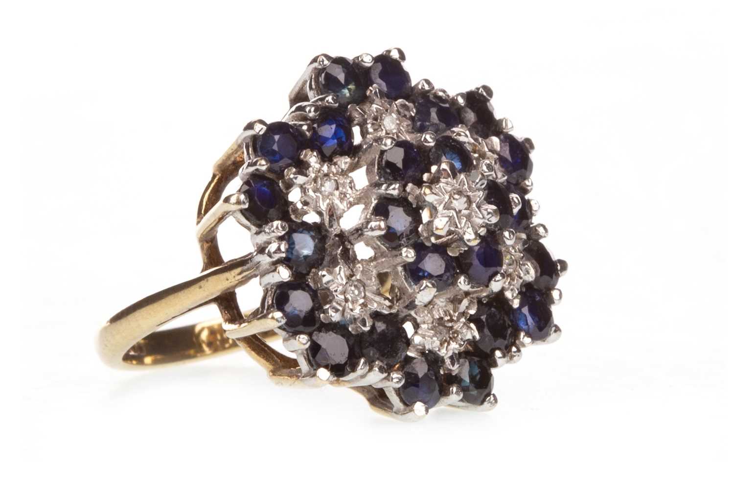 Lot 4 - A BLUE GEM AND DIAMOND CLUSTER RING