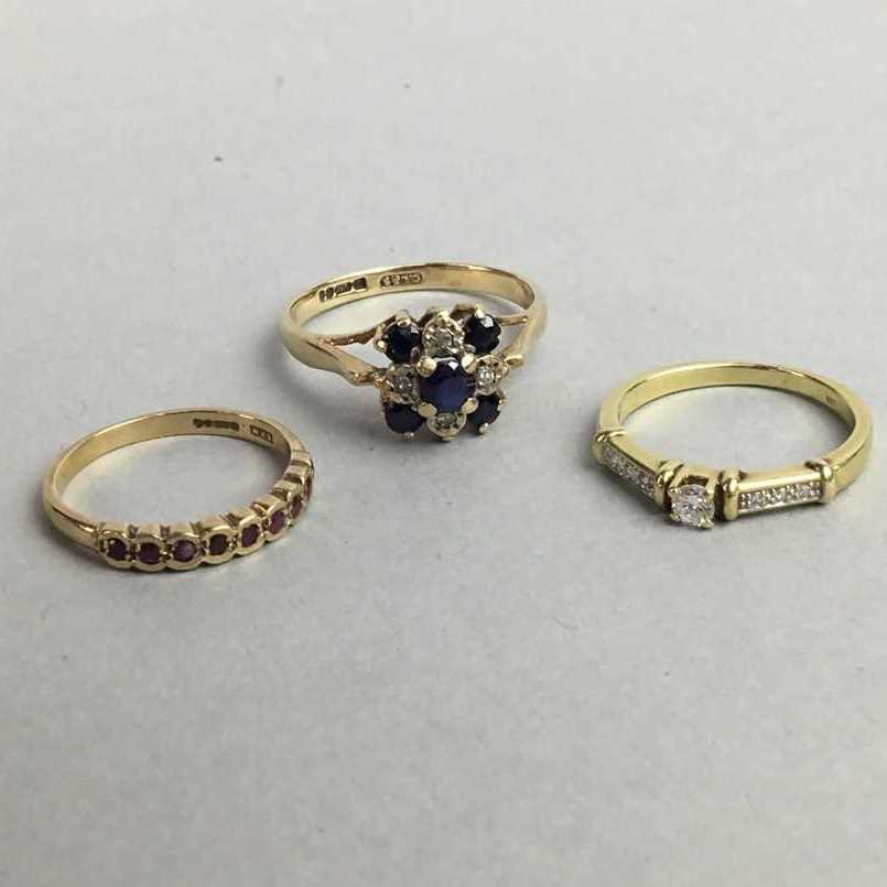 Lot 15 - A 15 CARAT GOLD ENGAGEMENT RING and TWO OTHER GOLD RINGS