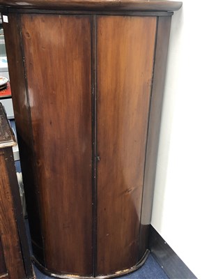 Lot 281 - A GEORGE III MAHOGANY BOWFRONT CORNER CUPBOARD