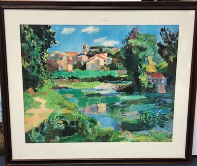 Lot 116 - A LARGE GICLEE PRINT DEPICITING A VILLAGE BY THE LAKE