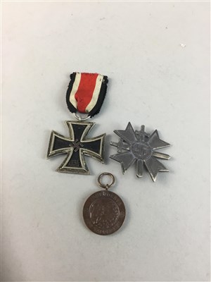 Lot 113 - A GERMAN IRON CROSS, A FINNISH MEDAL AND ANOTHER