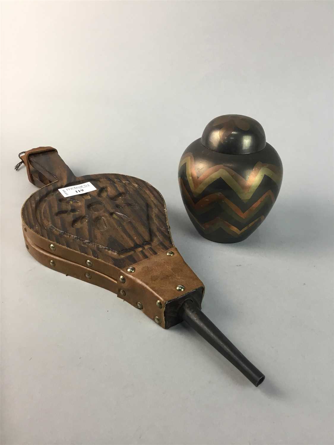 Lot 119 - A LEATHER JEWEL BOX, GINGER JAR, WALL MASK AND A PAIR OF BELLOWS