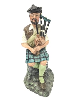 Lot 49 - A ROYAL DOULTON FIGURE OF 'THE PIPER'