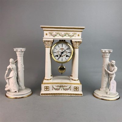 Lot 396 - A REPRODUCTION CERAMIC CLOCK AND A PAIR OF CANDLESTICKS
