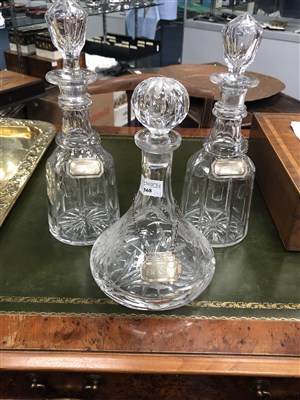 Lot 368 - THREE CRYSTAL DECANTERS WITH SILVER LABELS