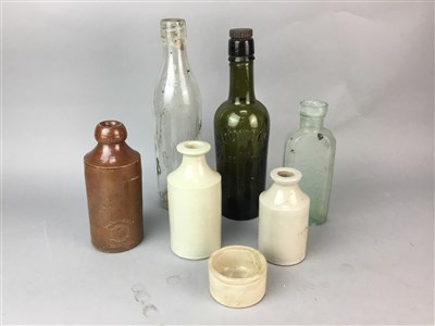 Lot 281 - A COLLECTION OF STONEWARE JARS AND COLOURED GLASS BOTTLES