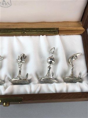 Lot 142 - A CASED SET OF CONTINENTAL SILVER PLACE HOLDERS