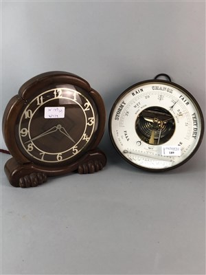 Lot 189 - A WALL HANGING ANEROID BAROMETER WITH THERMOMETER AND A MANTEL CLOCK