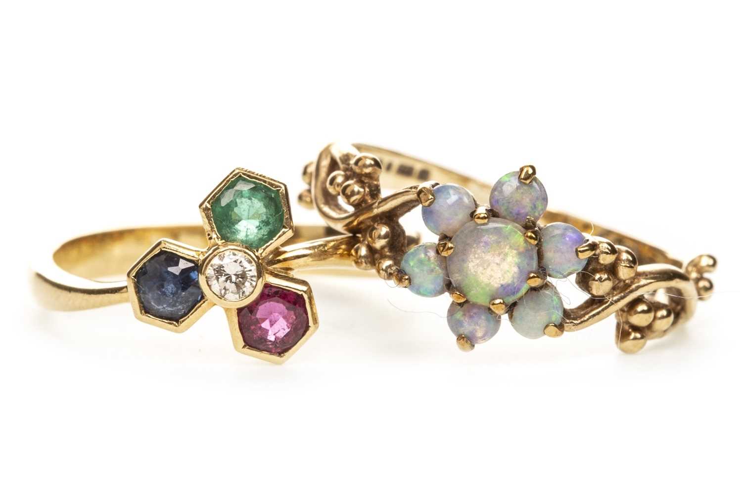 Lot 143 - A GEM SET RING AND AN OPAL RING