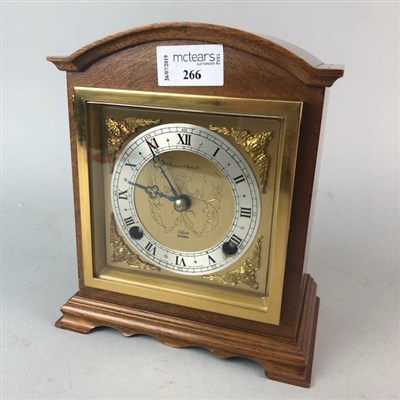 Lot 266 - A REPRODUCTION MANTEL CLOCK