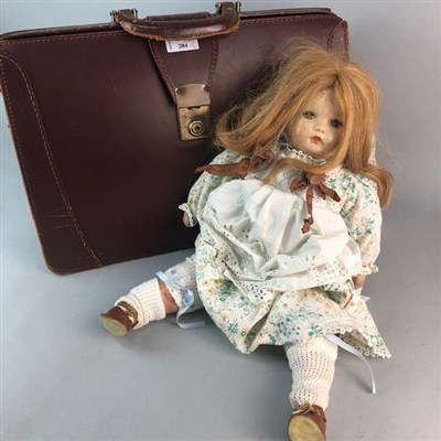 Lot 284 - A 20TH CENTURY DOLL AND A LEATHER BRIEFCASE
