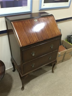 Lot 404 - A MAHOGANY BUREAU AND A COFFEE TABLE