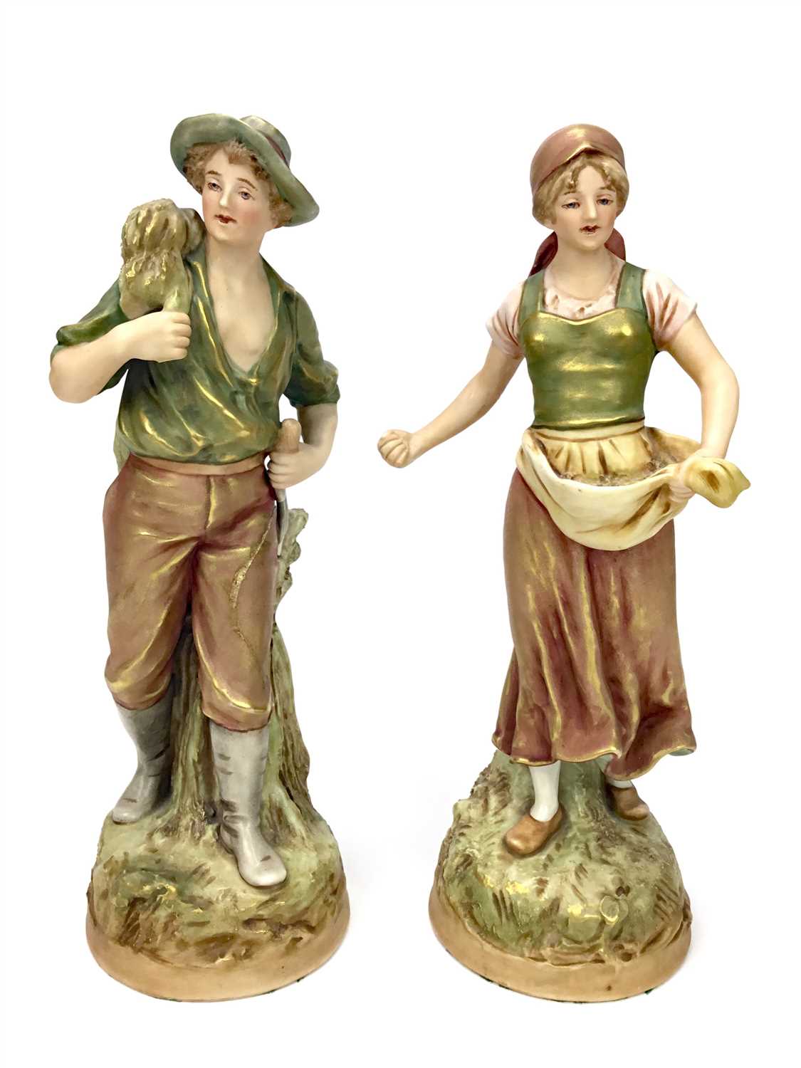 Lot 1230 - A PAIR OF ROYAL DUX FIGURES OF YOUNG FARMHANDS