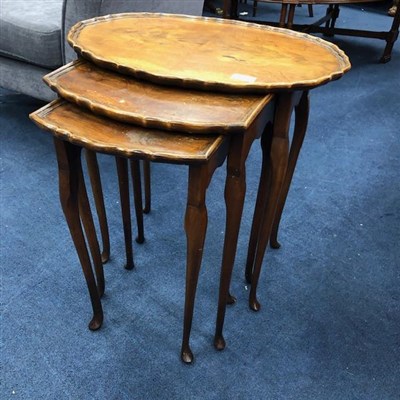 Lot 311 - A NEST OF THREE STAINED WOOD TABLES