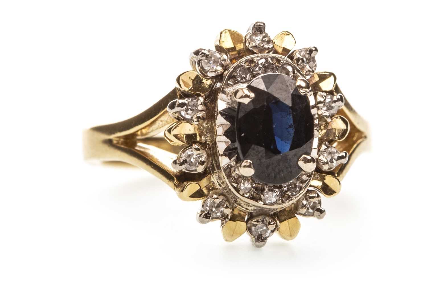 Lot 214 - A BLUE GEM AND DIAMOND CLUSTER RING