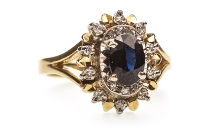 Lot 214 - A BLUE GEM AND DIAMOND CLUSTER RING