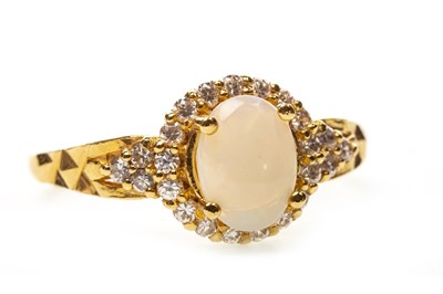Lot 8 - AN OPAL AND GEM SET RING