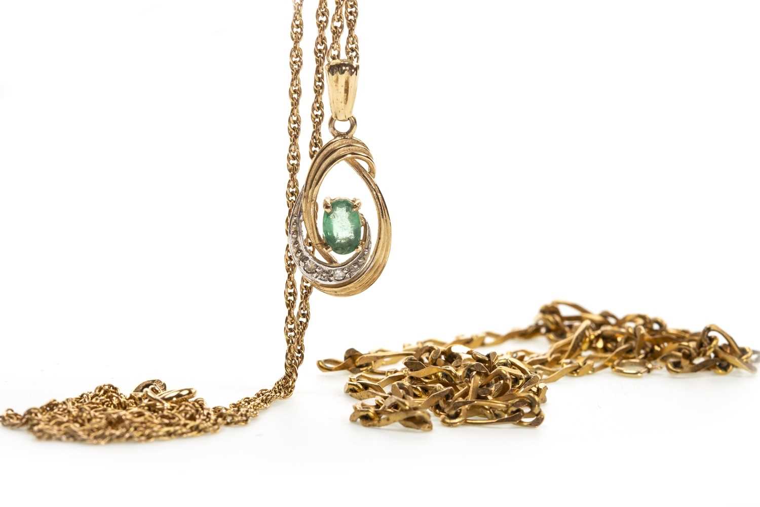 Lot 40 - A GREEN GEM SET PENDANT AND TWO CHAINS