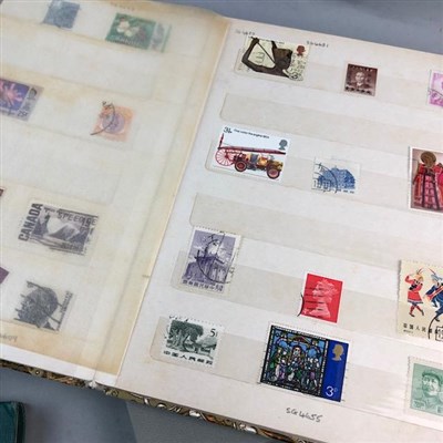 Lot 51 - A LOT OF THREE ALBUMS OF WORLD STAMPS AND LOOSE POSTCARDS