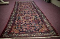 Lot 719 - EASTERN BORDERED RUNNER OF CAUCASIAN DESIGN...